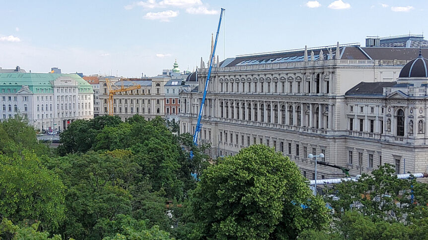 The vie from a window. Trees and buildings can be seen